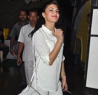Jacqueline Fernandez in White Transparent Shirt with Jeans at Bandra Mumbai.jpg