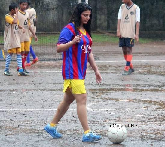 Rakhi Sawant Hot Legs Pics Latest Thighs Show Images 2014 in Yellow Short promotes FOOTBALL